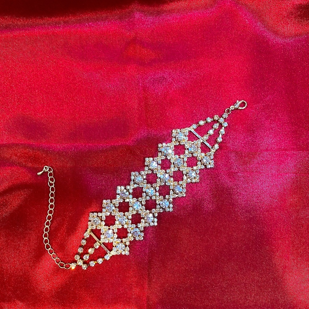 Rhinestone and gold costume jewelry bracelet.